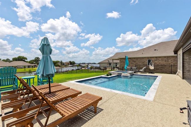 Relax poolside with stunning views of Lake Conroe. | Image 40