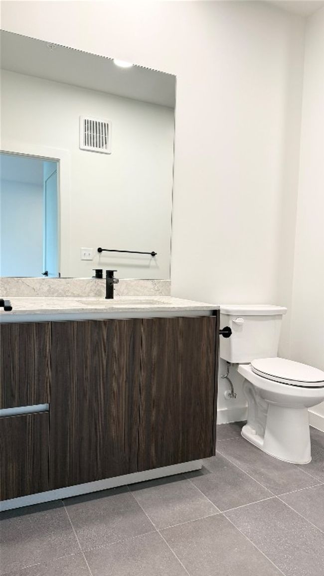 Bathroom featuring vanity and tile patterned floors | Image 17