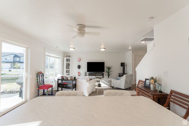 Bedroom featuring visible vents, access to exterior, and ceiling fan | Image 4
