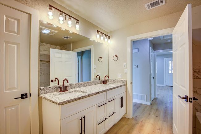 Bathroom featuring visible vents and a sink | Image 13