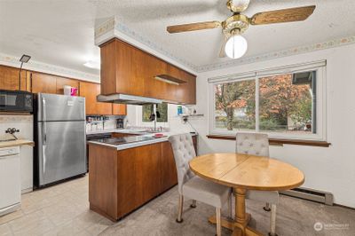 Dining to Kitchen off the entry and open to the living room. | Image 3