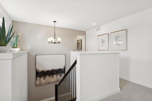 (Photo of a decorated model, actual homes finishes will vary) The upper level landing. | Image 12
