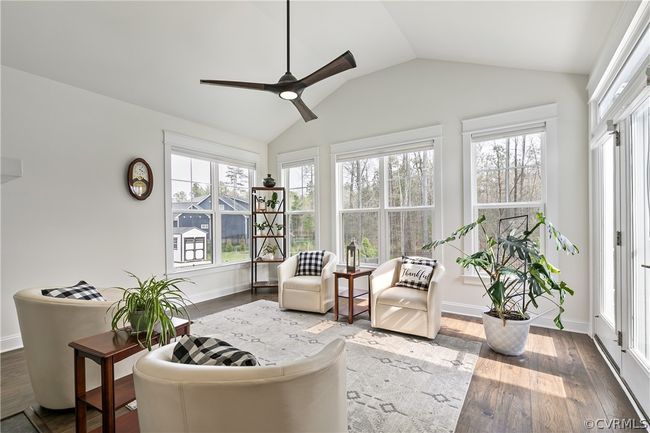 Sunroom featuring vaulted ceiling and ceiling fan | Image 18