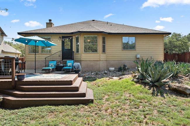 Back of property with a deck and a chimney | Image 26