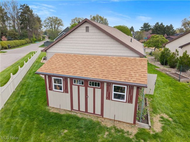 View of shed with a garden and a fenced backyard | Image 5