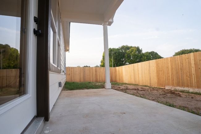 Fenced backyard featuring a patio area | Image 28