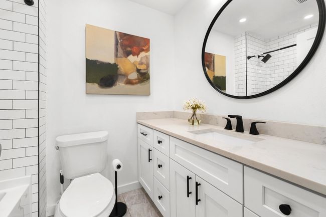 Bathroom featuring vanity, recessed lighting, tile patterned flooring, and bathing tub / shower combination | Image 19