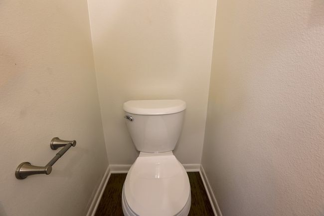 Powder Bathroom featuring toilet. | Image 7