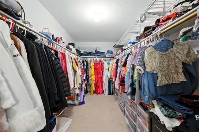 Spacious closet featuring carpet flooring | Image 25
