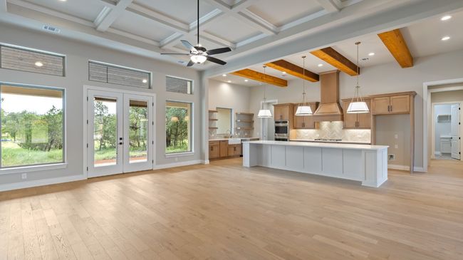 Kitchen featuring hanging light fixtures, tasteful backsplash, beamed ceiling, open floor plan, and recessed lighting | Image 19