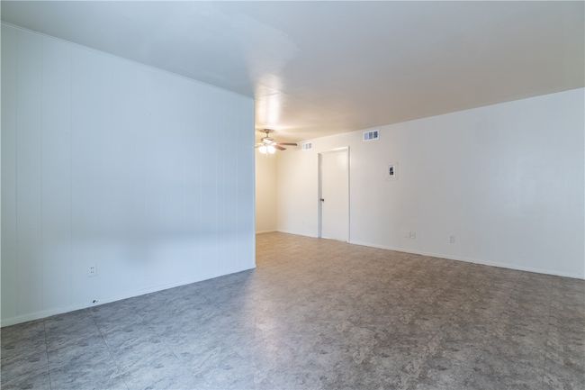 Spare room featuring tile patterned floors and a ceiling fan | Image 4