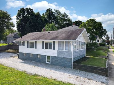 View of home's exterior and driveway | Image 3