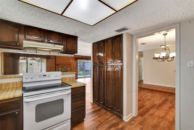 Kitchen is next to the formal dining area. | Image 20