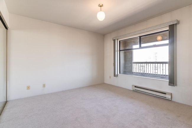 Unfurnished room featuring carpet and a baseboard radiator | Image 8