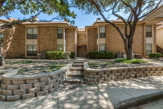 Multi unit property featuring brick siding and cooling unit | Image 10