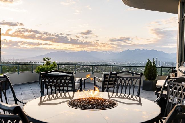 View of patio / terrace featuring a fire pit and a mountain view | Image 9