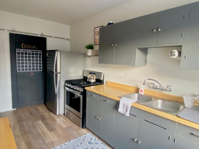 Stainless steel appliances complement the kitchen | Image 13