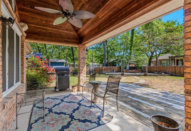 Covered patio area and extended uncovered wood deck area | Image 23