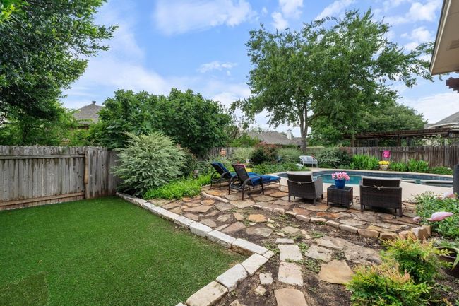 View of pool featuring a pergola, fenced backyard, outdoor dining area, and a pool / hot tub. | Image 35