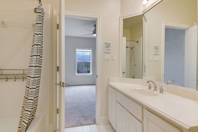 Private bathroom attached to guest bedroom located upstairs. | Image 29