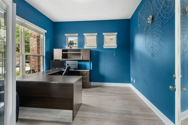 The office downstairs was originally a formal dining room. The owners added french doors for privacy and this room can be used as an office or downstairs bonus/play room. | Image 17