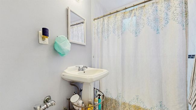 Full bathroom with curtained shower | Image 19