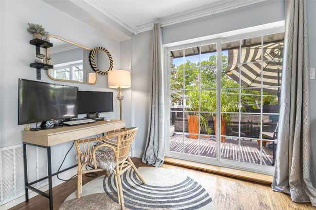 Office area with ornamental molding and wood finished floors | Image 30
