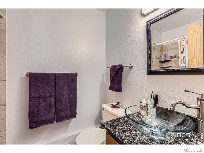 Sleek Glass Vessel Sink in Primary 3/4 Bath | Image 15