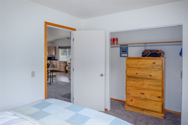 Bedroom featuring carpet floors and vaulted ceiling | Image 91