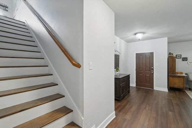 Staircase with wood finished floors and baseboards | Image 10