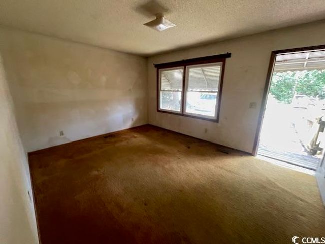 Spare room with carpet floors and a textured ceiling | Image 9