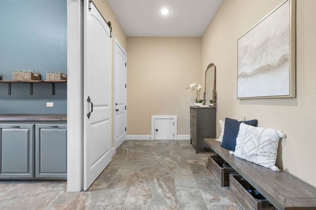 HUGE mudroom or drop zone right off of the garage! Peek the mini-grocery door to the pantry! | Image 15