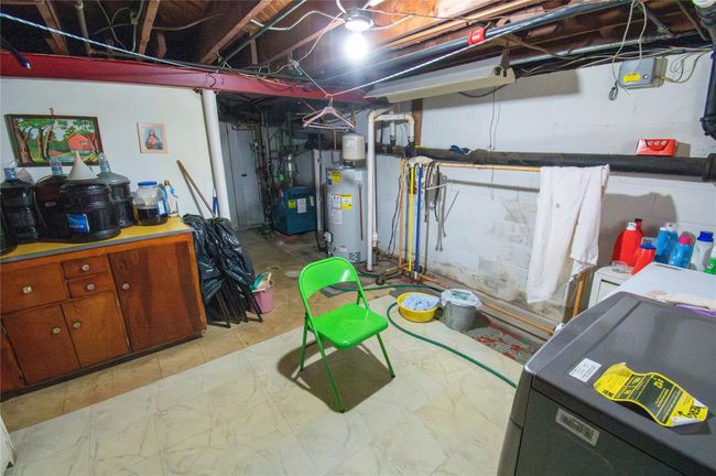 Unfinished basement with water heater | Image 24