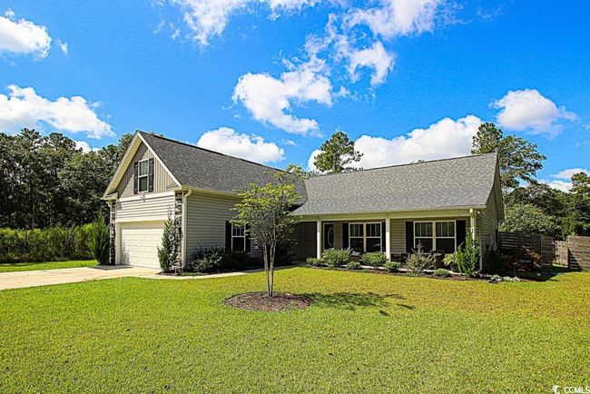 View of front of property with a front yard and a garage | Image 32