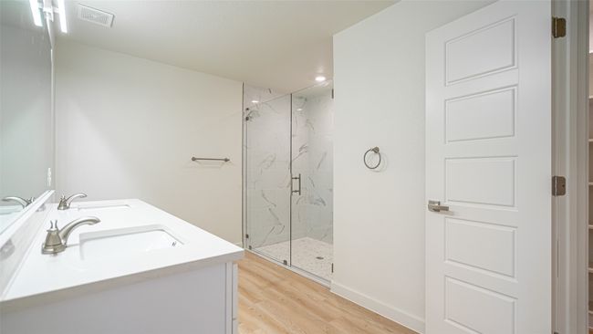 Primary bath with double sinks and massive walk in shower | Image 19