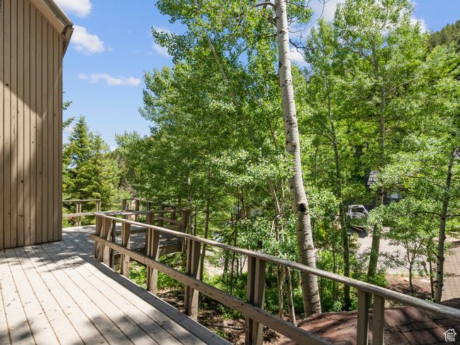 Deck featuring view of wooded area | Image 19