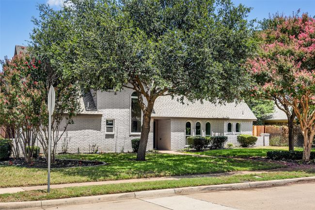 View of front of property featuring brick siding and roof with shingles | Image 20