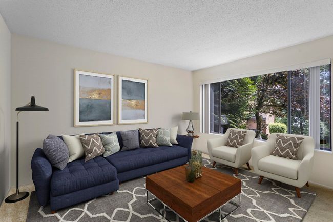 Living room featuring carpet floors and a textured ceiling | Image 7