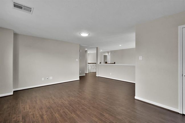 Game Room. Stairs are ahead on the right. | Image 24