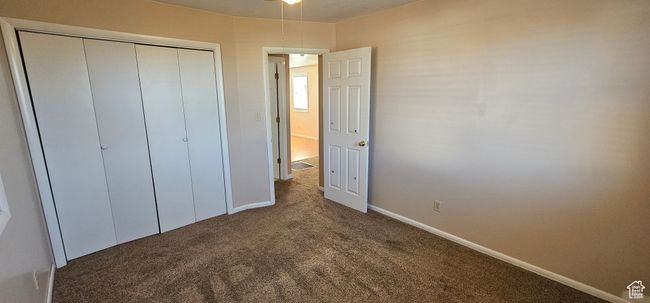 Unfurnished bedroom featuring a closet and carpet | Image 34