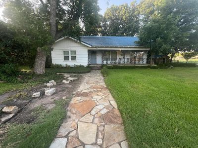 Ranch-style house with a front lawn | Image 1