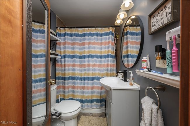 Full bath featuring vanity and curtained shower | Image 14