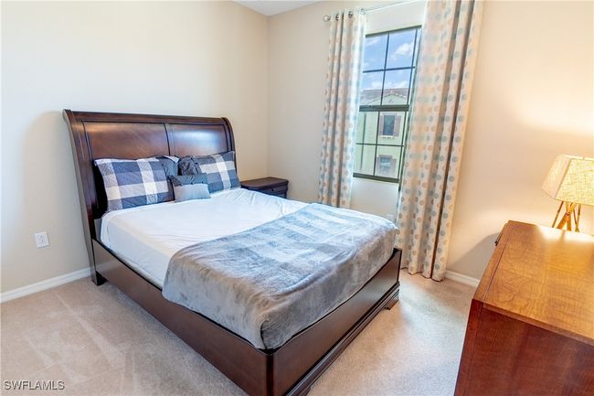 Bedroom with light colored carpet and baseboards | Image 20