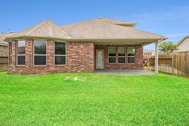 The large covered patio is ready for gathering and the potential for your own outdoor kitchen ideas. | Image 34