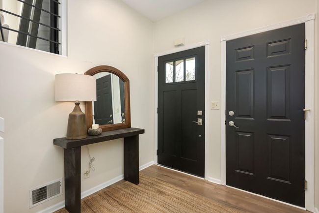 Main entry door (with windows) and access door to garage - this is the foyer. | Image 30