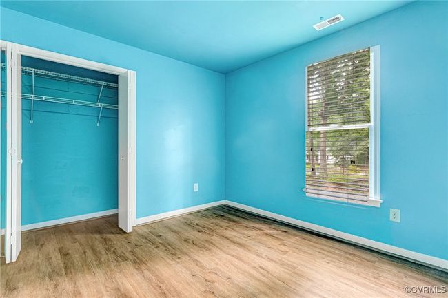 Unfurnished bedroom featuring wood finished floors and a closet | Image 16