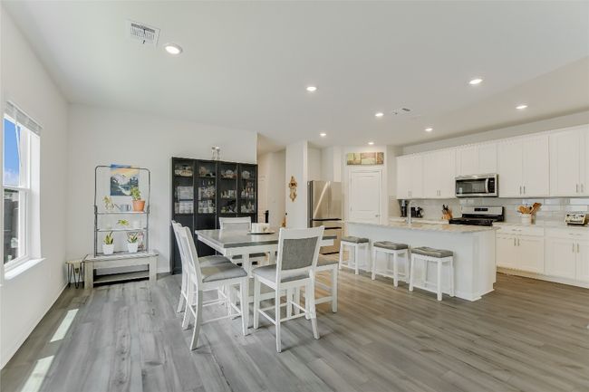 Dining area with light wood finished floors and recessed lighting | Image 4