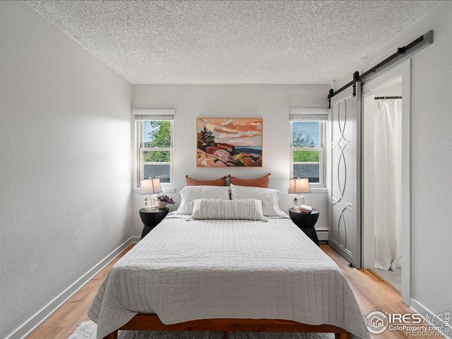Primary bedroom with barn door to bathroom | Image 15