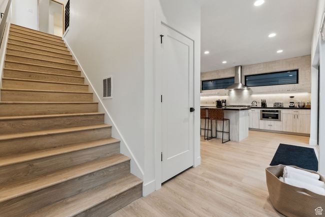 Stairs featuring wood-type flooring | Image 17