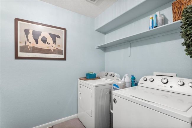 Washroom featuring washer and clothes dryer and baseboards | Image 27